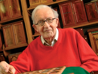 Philip Grierson in front of the medieval cabinets in the Grierson Room, 2005, copyright the Fitzwilliam Museum